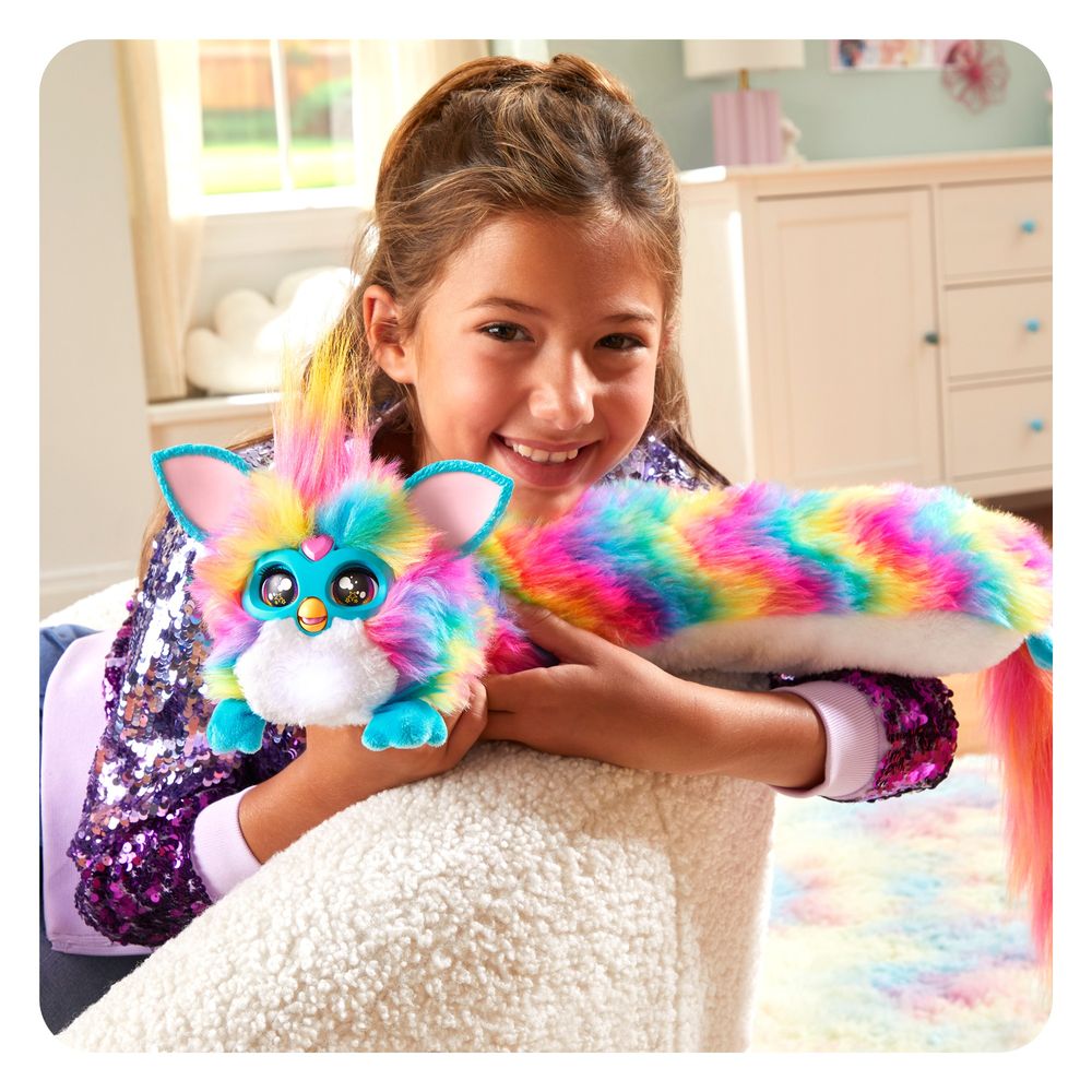 A kid hugging DJ Furby